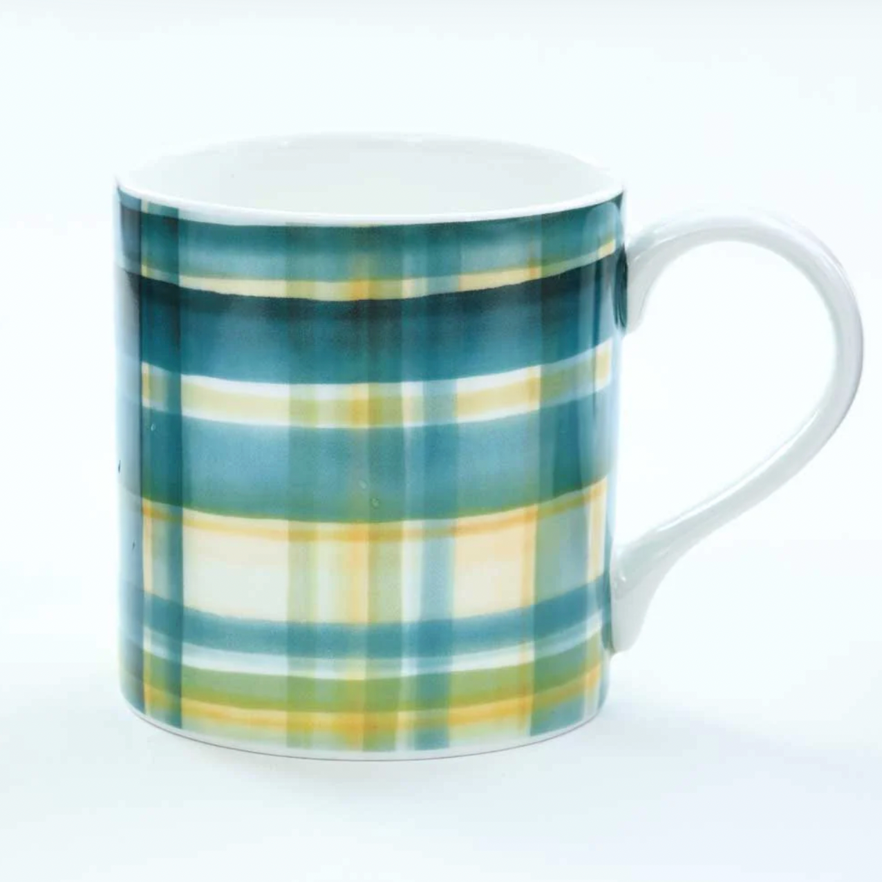Mug with green and yellow plaid pattern on a white background