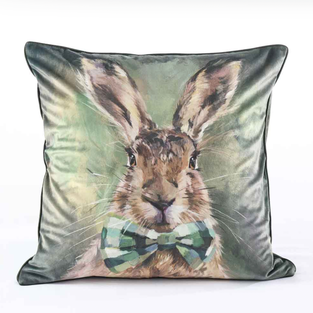 Decorative pillow with a rabbit design and bow tie on a white background