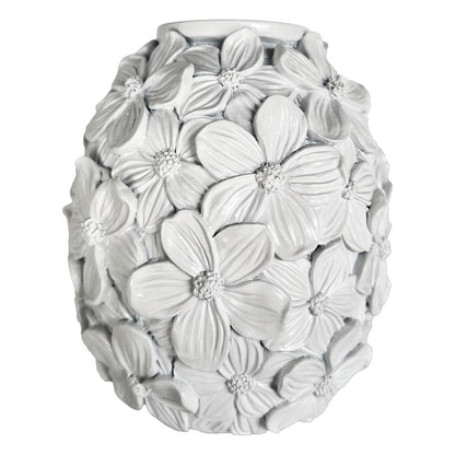 Decorative white vase with floral patterns on a white background