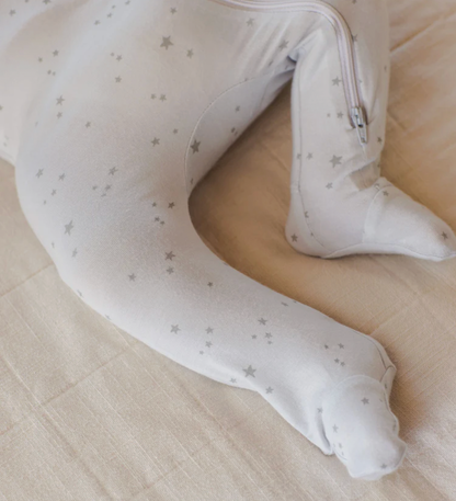 White baby wrap with star pattern on a beige surface