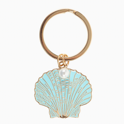 Keychain with a light blue shell and pearl design on a white background