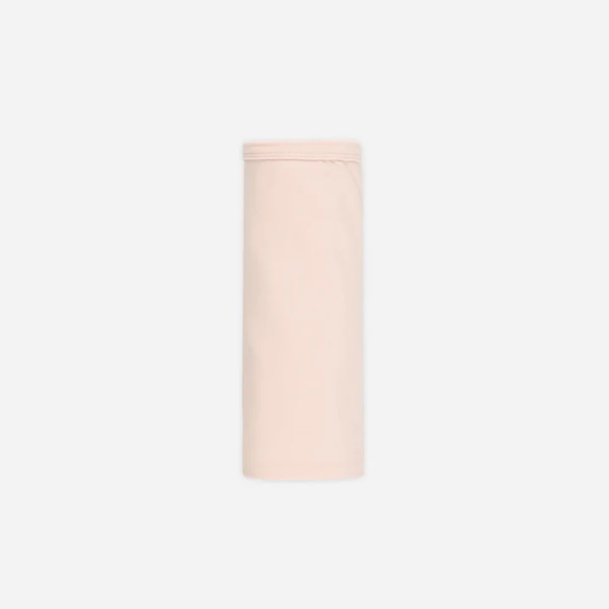 Cylindrical light pink object on a white background