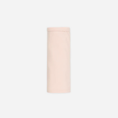 Cylindrical light pink object on a white background