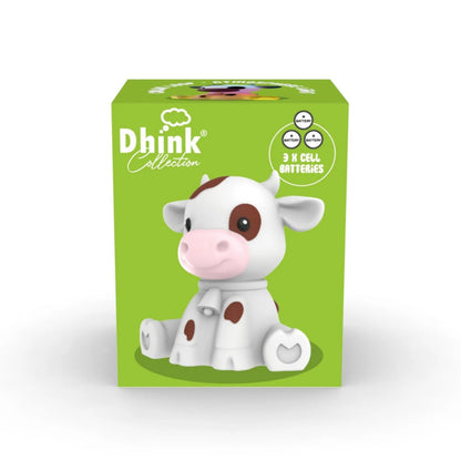 Dthink Collection cow figurine on a green box with white background