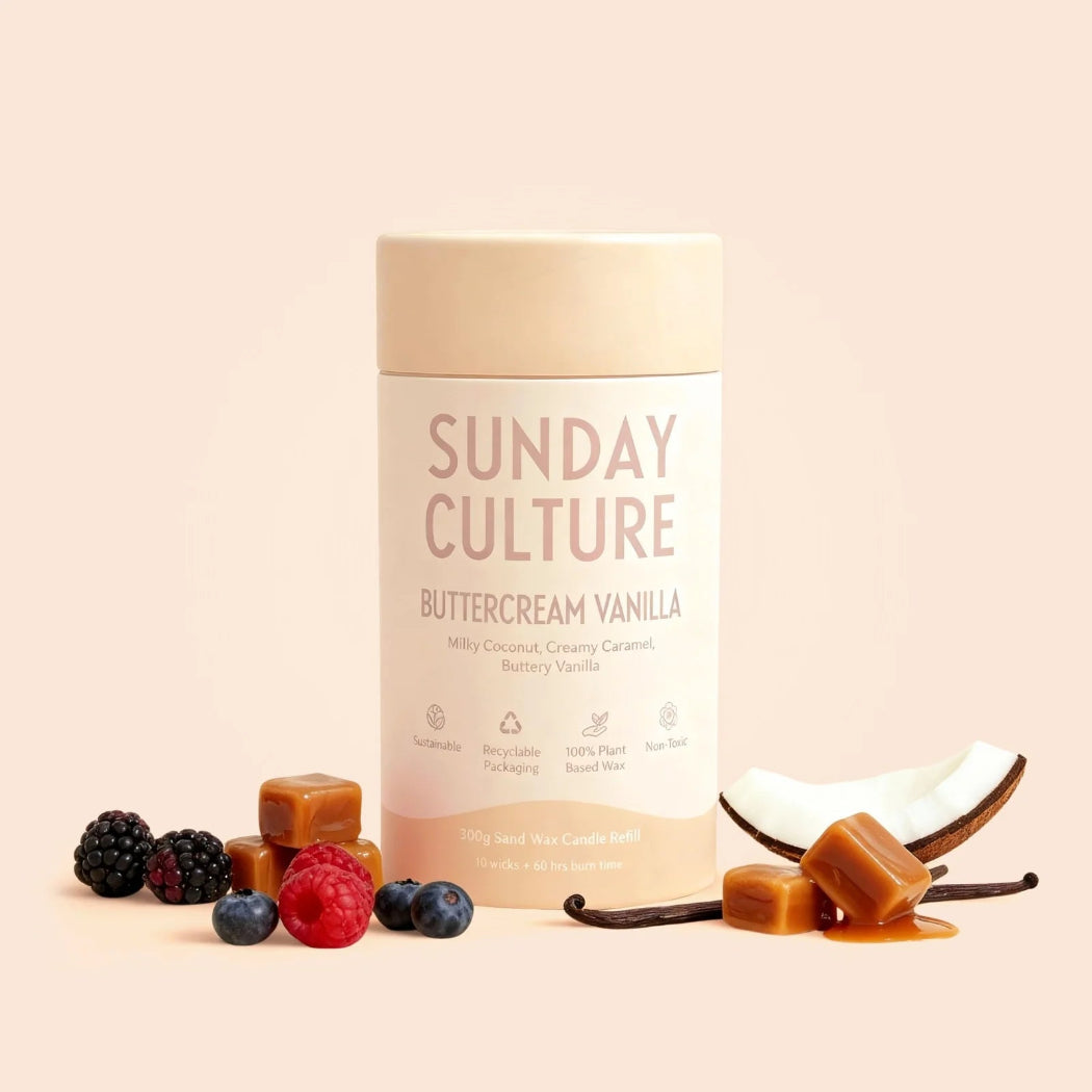 Sunday Culture Buttercream Vanilla product with vanilla beans, berries, and coconut on a light background