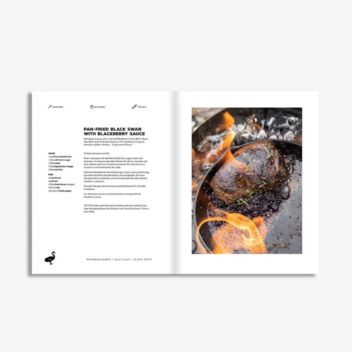 Open cookbook showing a recipe for pan-fried black swan with blackberry sauce.