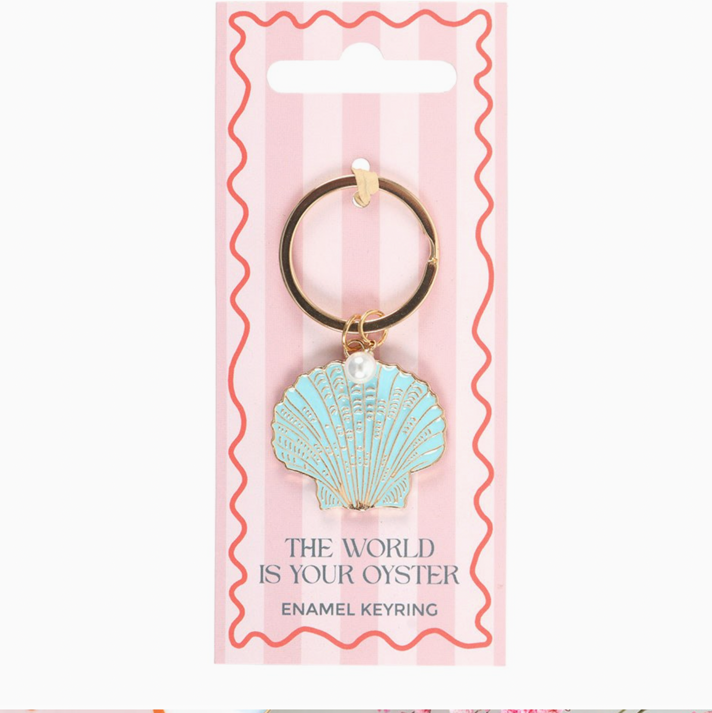 Seashell keychain on a pink and white striped card with text