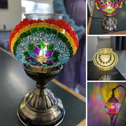 Colorful mosaic lamp with rainbow design on a reflective surface.