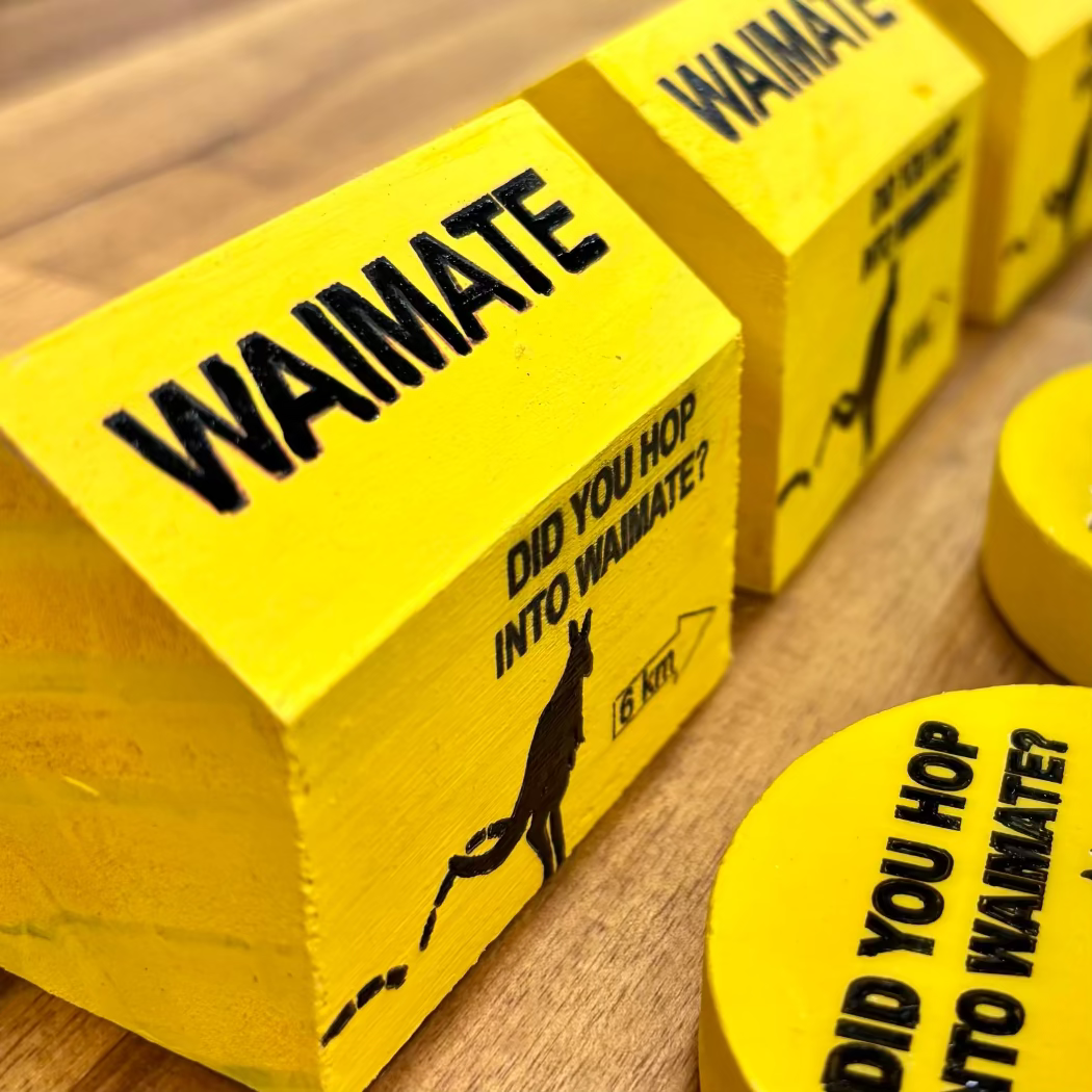 Yellow blocks with 'WAIMATE' branding and a wallaby graphic on a wooden surface.