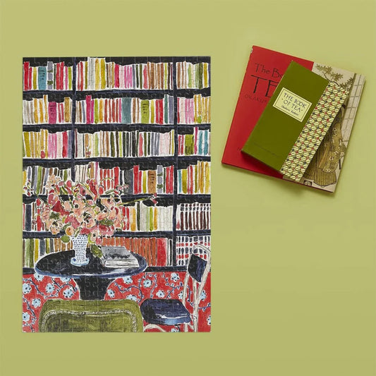Greeting card with a colorful bookshelf design on a green background