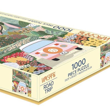 Jigsaw puzzle box with 'Road Trip' theme featuring a car and scenic design.