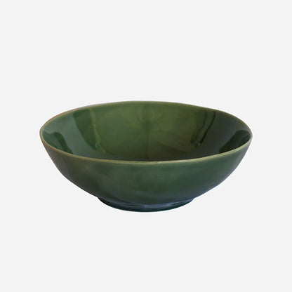 Green ceramic bowl on a white background