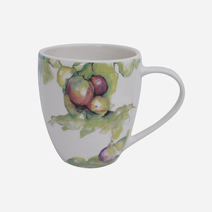 White mug with fruit design on a white background