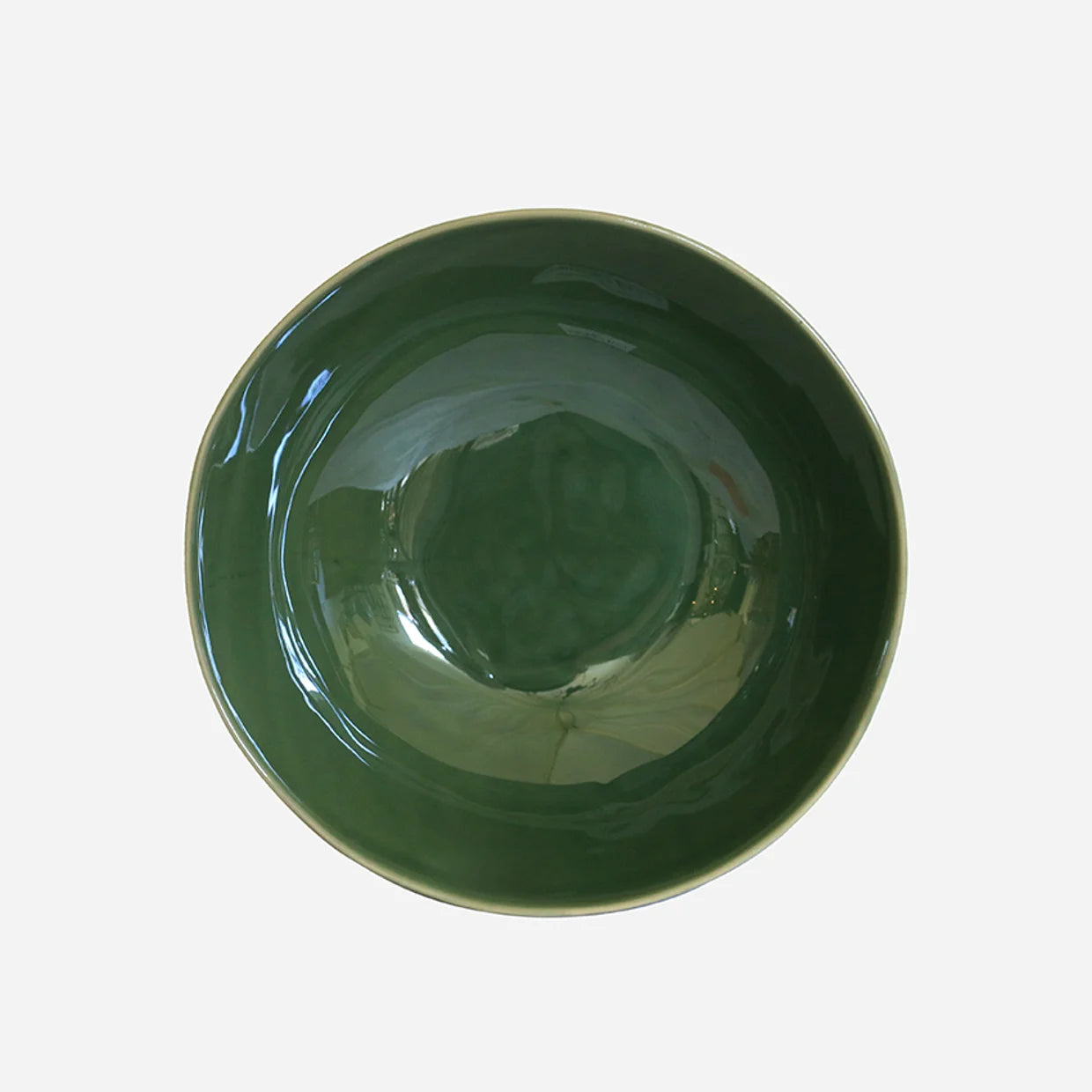 Green ceramic bowl on a white background