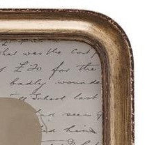 Silhouette in a wooden frame on a piece of text paper