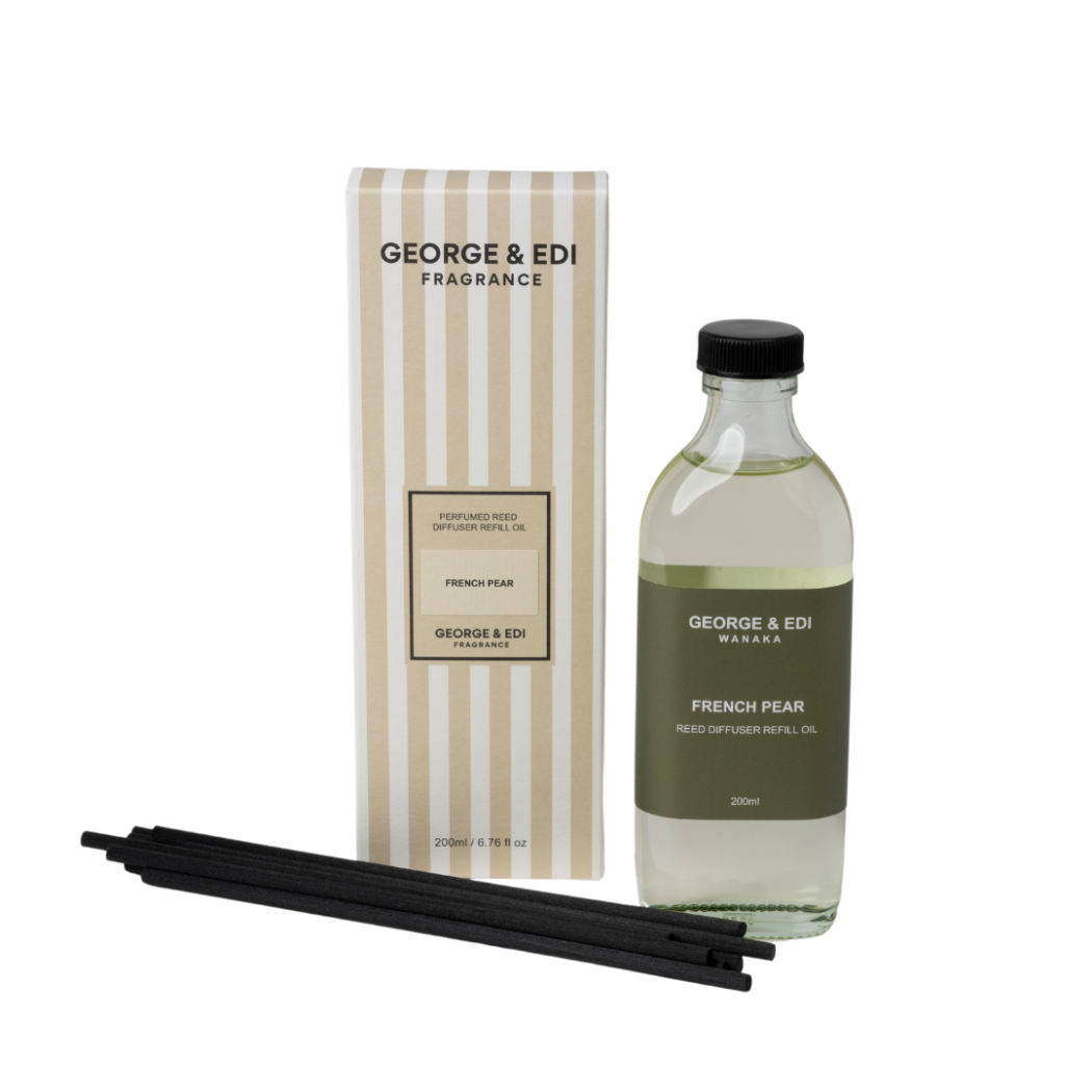 George & Edi fragrance bottle with packaging and sticks on a white background