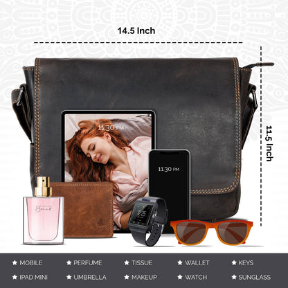 Black leather satchel with dimensions, containing a tablet, phone, wallet, watch, and sunglasses on a light gray background.