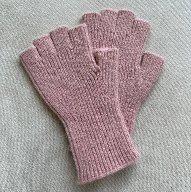 Pair of pink fingerless gloves on a light gray background