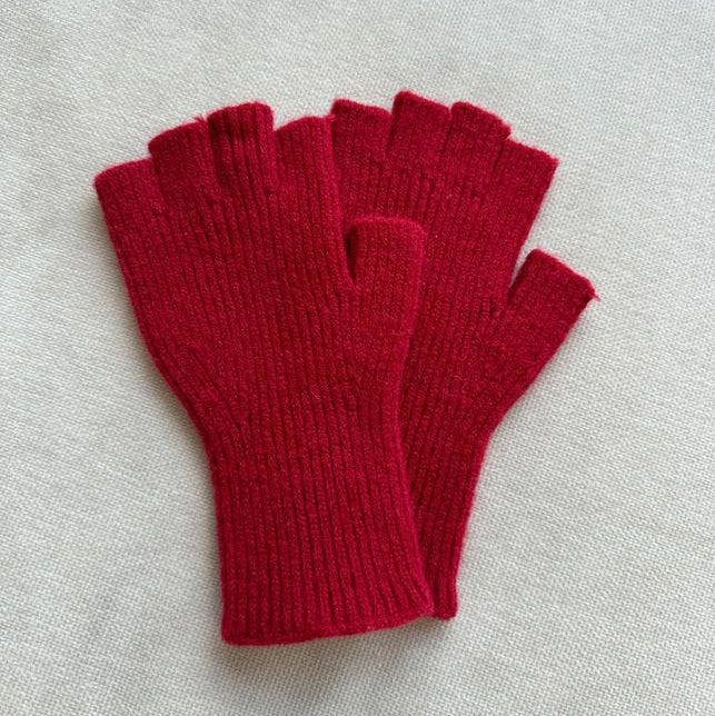 Pair of red fingerless gloves on a light gray background
