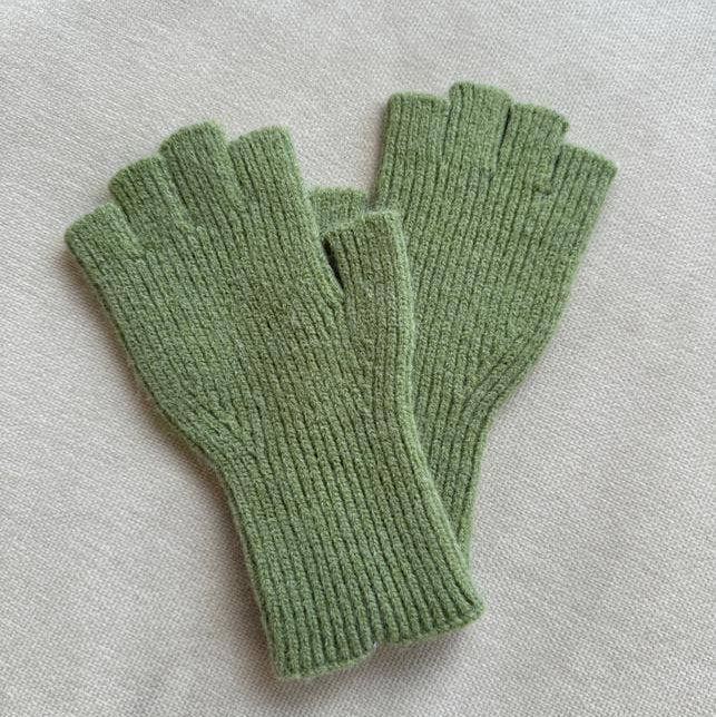 Pair of green fingerless gloves on a light gray background