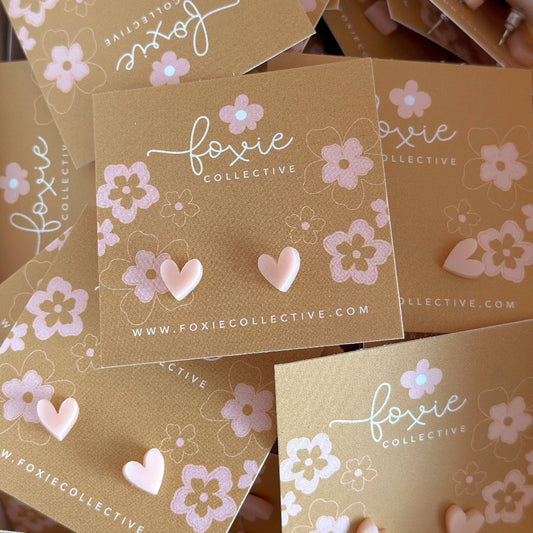 Foxy Collective packaging with floral designs and website URL.