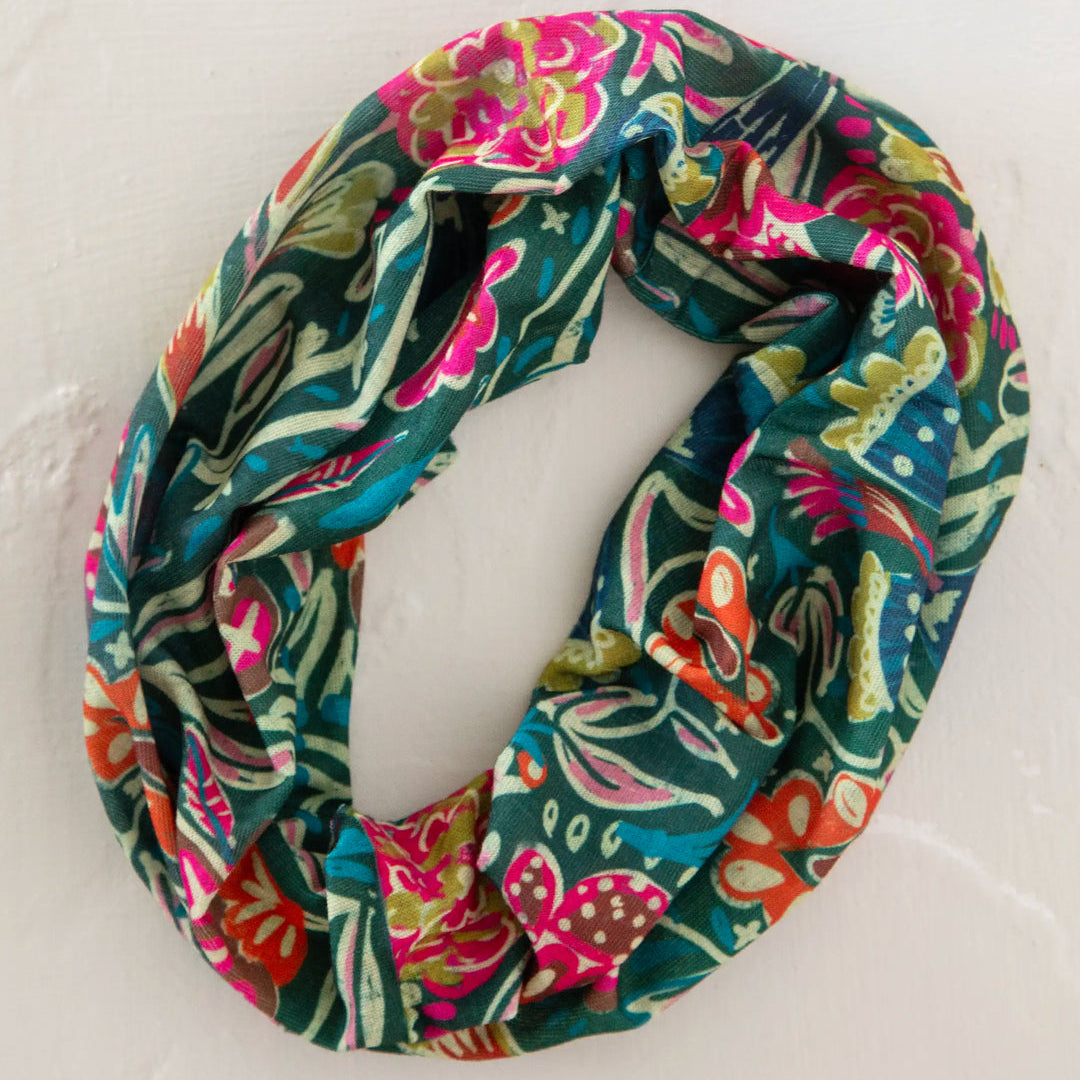 Colorful floral patterned infinity scarf on a white background