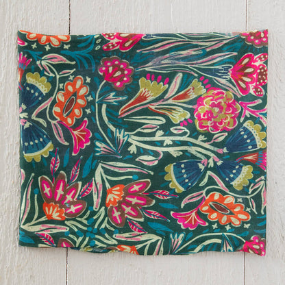 Colorful floral patterned fabric on a wooden surface