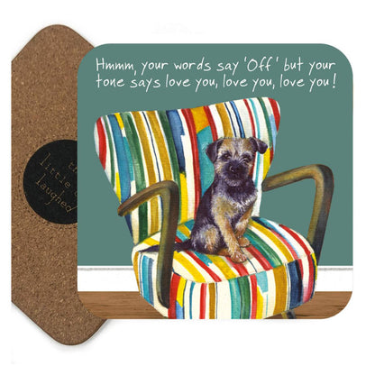 Card with a dog on a colorful striped chair and humorous text, with a cork backer.