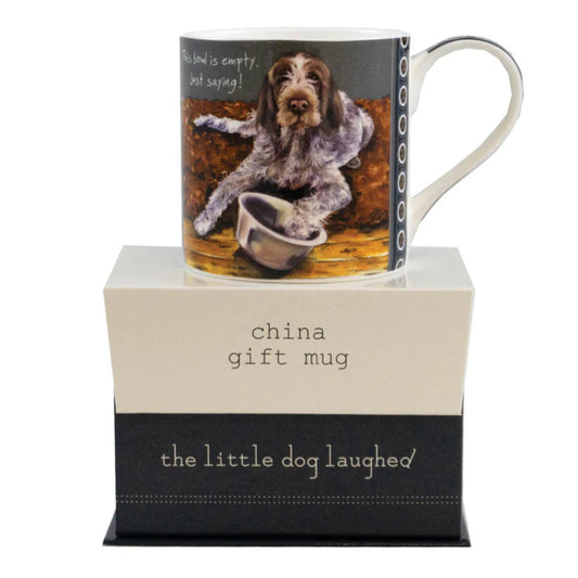 Mug with a dog illustration and text 'The bowl is empty, just saying!' on a matching box.