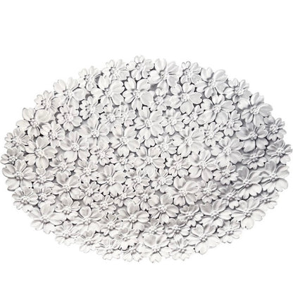 White floral-patterned doormat on a white background
