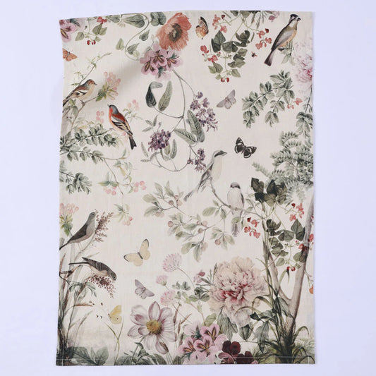 Floral and bird patterned fabric on a light purple background