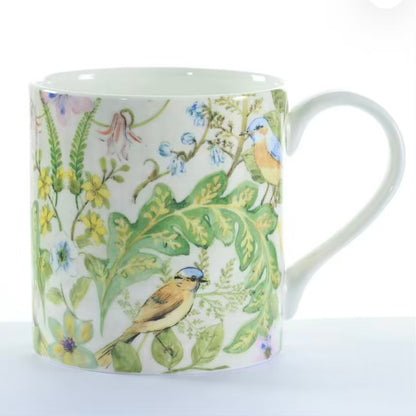 Mug with bird and floral design on a white background
