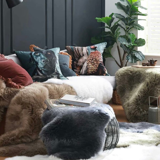 Collection of M Linen sheepskin throws, rugs and cushions