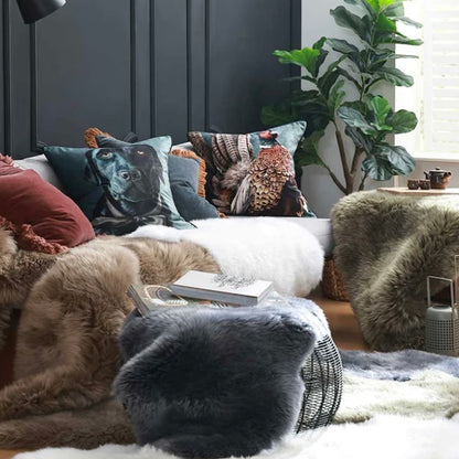 Collection of M Linen sheepskin throws, rugs and cushions