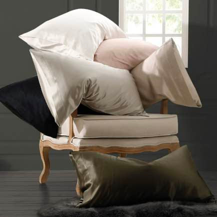 Chair with multiple pillows in a room setting