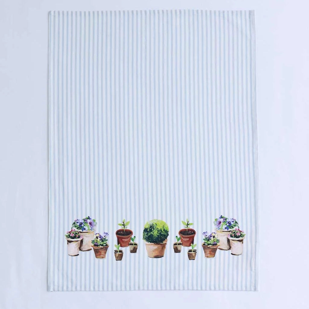 A rectangular white tea towel with thin vertical light blue stripes and a row of illustrated potted plants along the bottom edge, displayed flat against a white background.