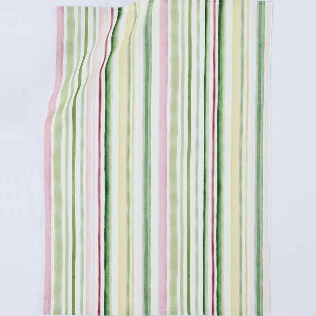 A rectangular textile item, likely a towel or blanket, featuring a vertical striped pattern in soft pastel shades of green, pink, yellow, and white, laid flat against a light gray background.