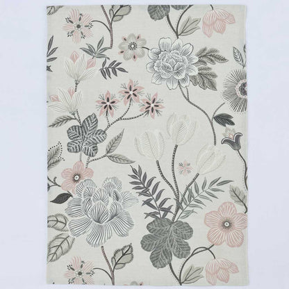 A rectangular area rug with a botanical floral pattern featuring gray, white, and soft pink flowers with green leaves on an off-white background, shown flat against a light gray backdrop.