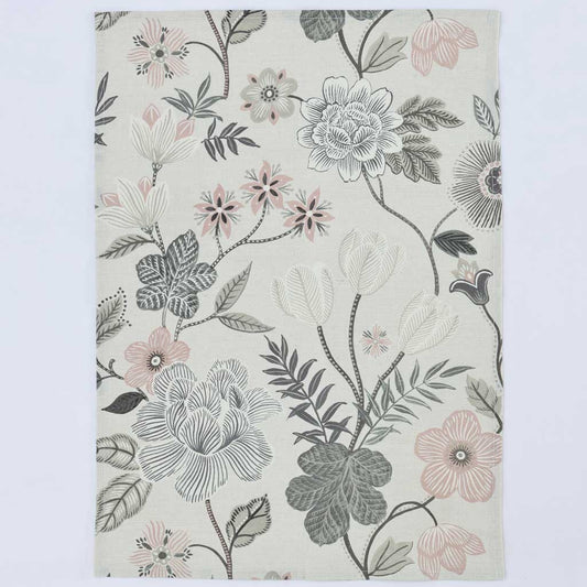 A rectangular area rug with a botanical floral pattern featuring gray, white, and soft pink flowers with green leaves on an off-white background, shown flat against a light gray backdrop.