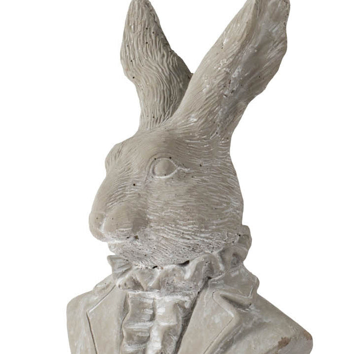 Decorative rabbit sculpture in a suit on a white background