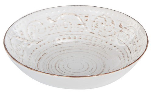 White ceramic bowl with textured design on a white background