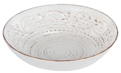 White ceramic bowl with textured design on a white background