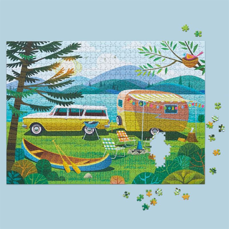 Jigsaw puzzle with a camping scene featuring a car and trailer.