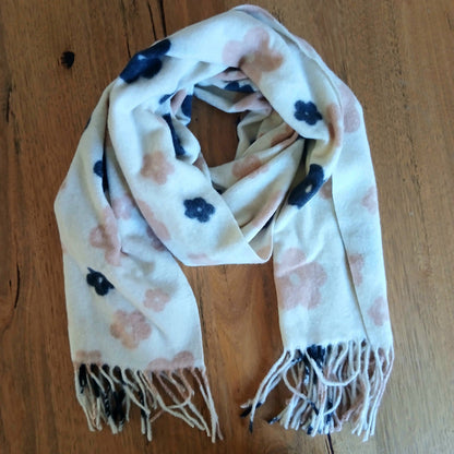 Scarf with floral pattern on a wooden surface