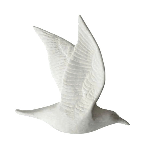 A white unglazed bone china bird with double closed wing in flight position.