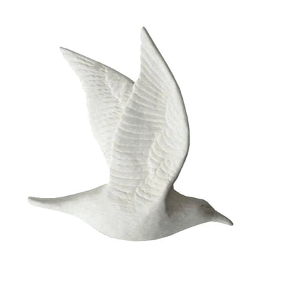 A white unglazed bone china bird with double closed wing in flight position.