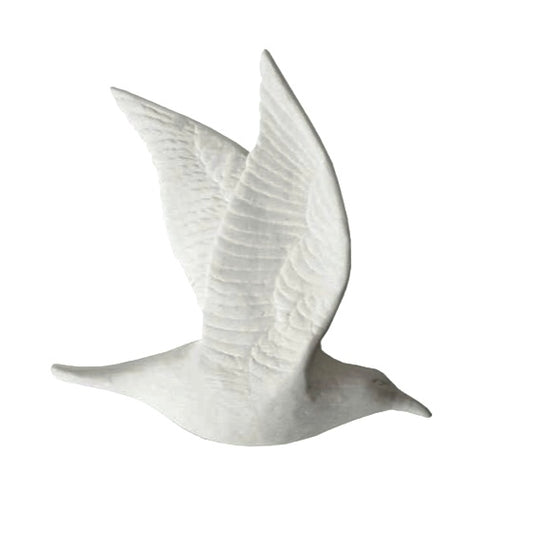 A white unglazed bone china bird with double closed wing in flight position.